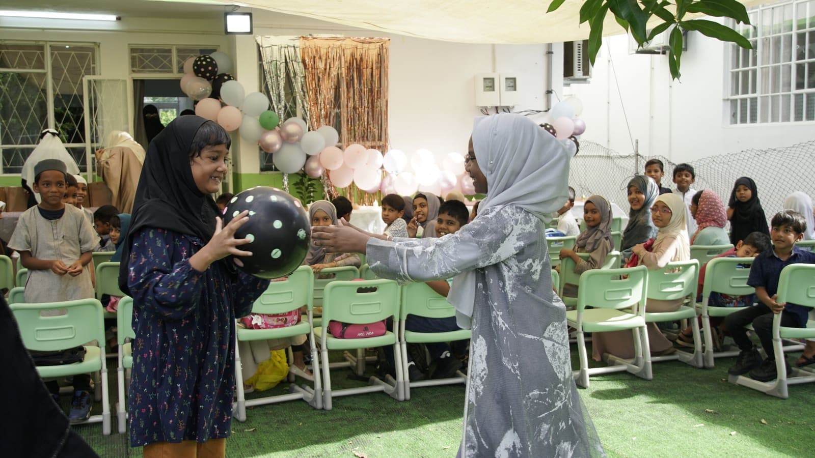 Students at an event on the Oasis Academy campus